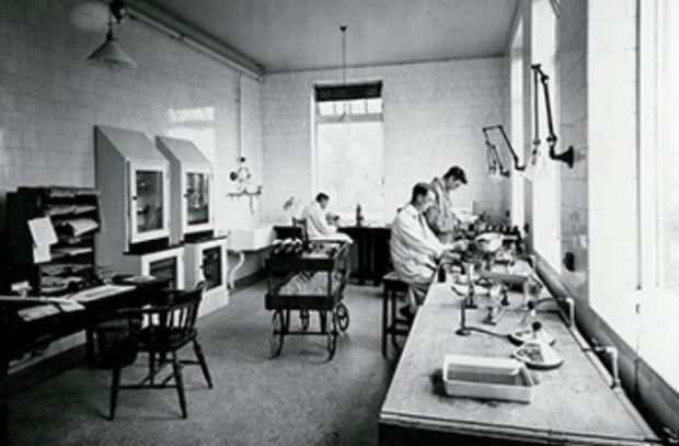 Photo of scientists working in a Weybridge lab between the wars