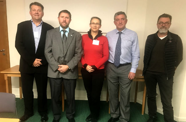 Photo of the European Association of State Veterinary Officers Board standing up: Five people standing facing the camera, 2 men, a lady and 2 more men.