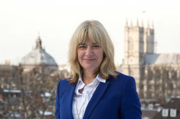 Photo of Dr Christine Middlemiss in front of Westminster Abbey