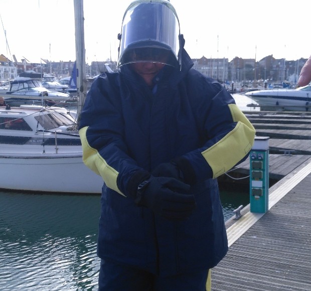 Vet in full kevlar suit with visor and jacket