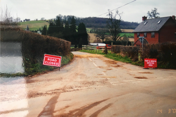 A closed road with an FMD sign