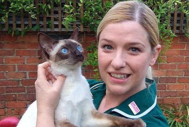 Alexandra Taylor holding Spud the cat